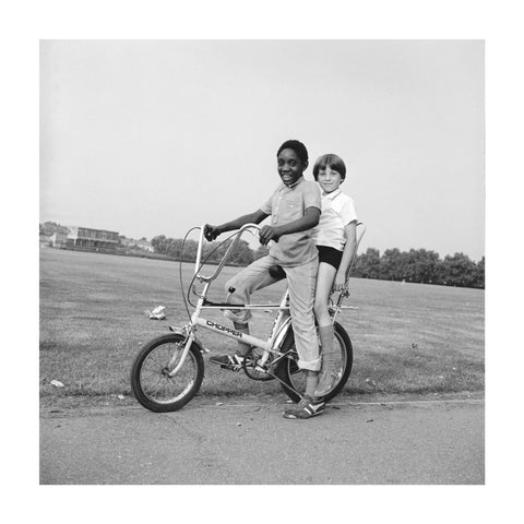 Two boys riding a bicycle 1973
