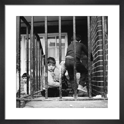 Children play outside their homes near Brick Lane 1983
