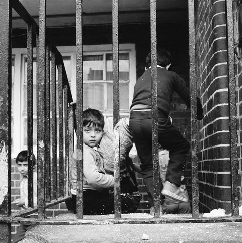 Children play outside their homes near Brick Lane 1983