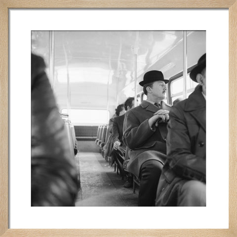 A City gent on the top deck of a London bus 20th century