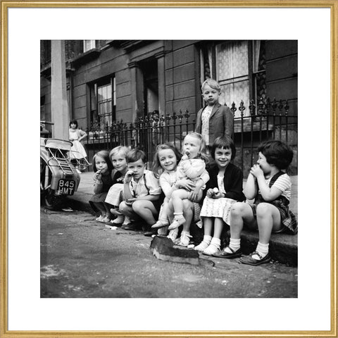 Children sitting on the curb Maida Vale 1960