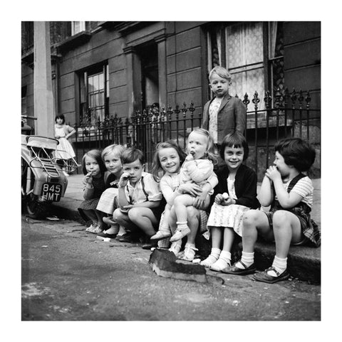 Children sitting on the curb Maida Vale 1960