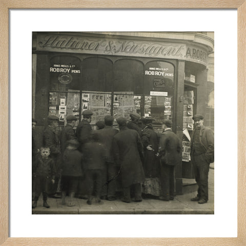 A crowd gathered around an East End newsagents window display c.1900