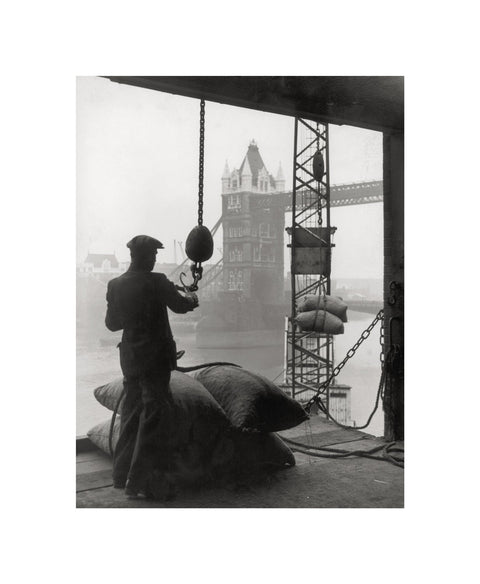 Pool of London Dockworker handling a cargo of bagged nuts 1947