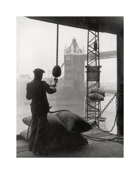 Pool of London Dockworker handling a cargo of bagged nuts 1947