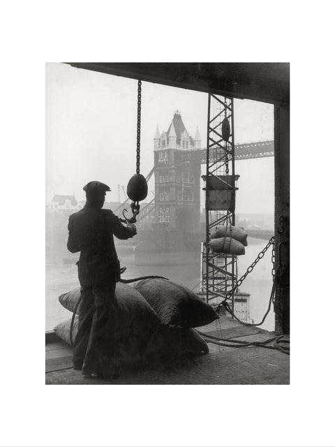 Pool of London Dockworker handling a cargo of bagged nuts 1947