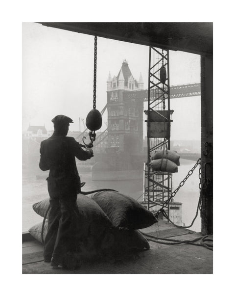 Pool of London Dockworker handling a cargo of bagged nuts 1947
