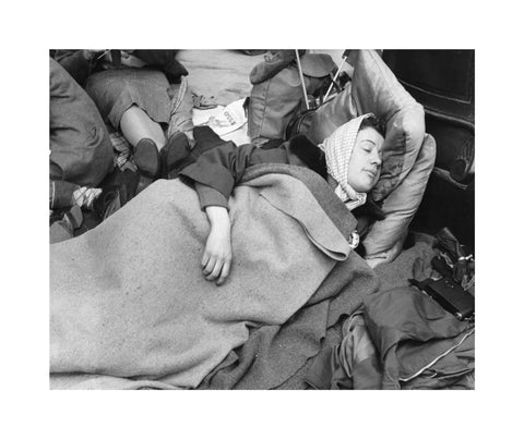 A woman camps out on the street for Queen Elizabeth's Coronation 1953