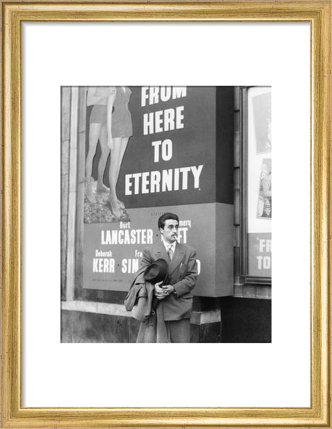 A man standing outside the Odeon cinema at Hyde Park Corner c. 1953