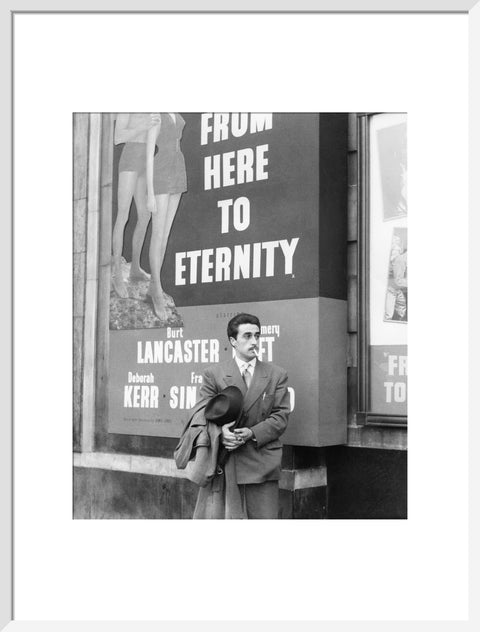 A man standing outside the Odeon cinema at Hyde Park Corner c. 1953