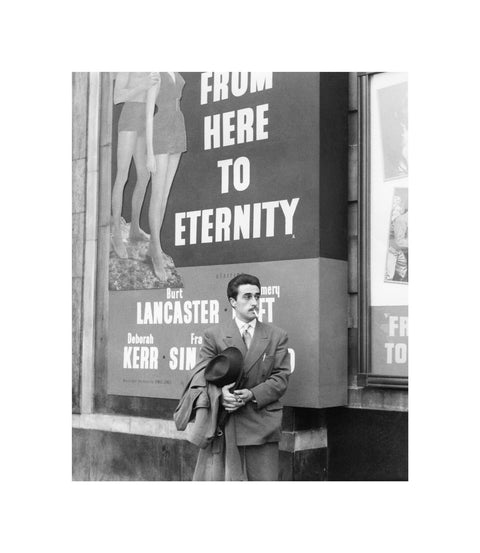A man standing outside the Odeon cinema at Hyde Park Corner c. 1953