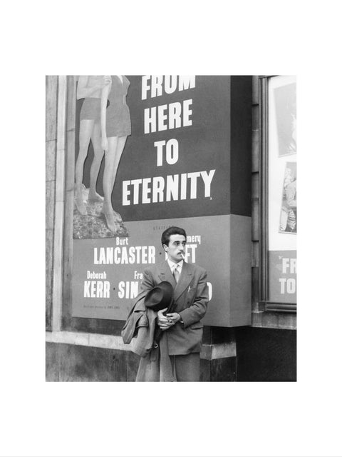 A man standing outside the Odeon cinema at Hyde Park Corner c. 1953