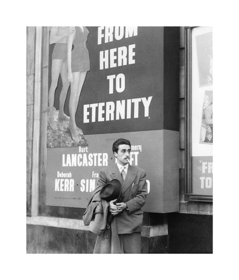 A man standing outside the Odeon cinema at Hyde Park Corner c. 1953