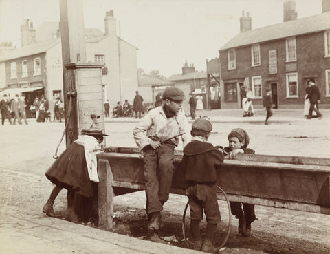 Children Children playing at a water trough in Barnet High Street c.1900
