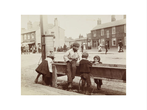 Children Children playing at a water trough in Barnet High Street c.1900