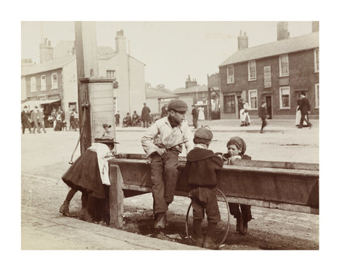 Children Children playing at a water trough in Barnet High Street c.1900