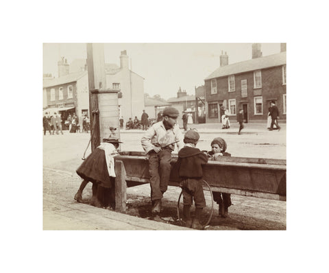 Children Children playing at a water trough in Barnet High Street c.1900