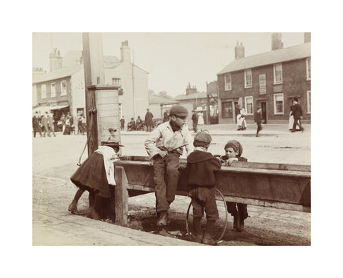 Children Children playing at a water trough in Barnet High Street c.1900