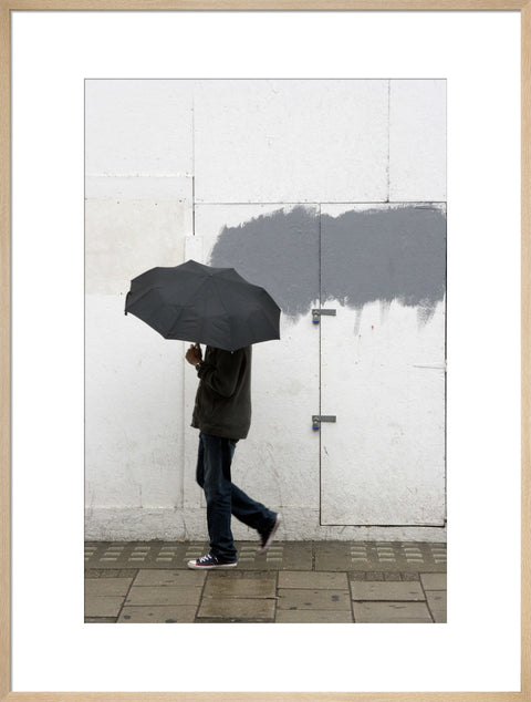 A man walking with umbrella in New Oxford Street 2008