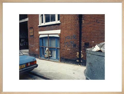 Two children looking out of a window 1986
