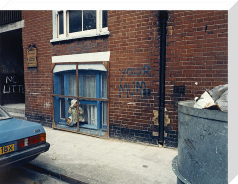 Two children looking out of a window 1986