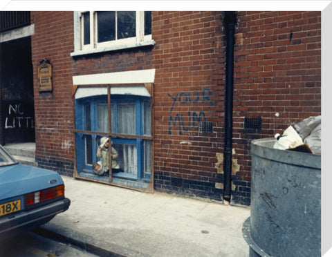 Two children looking out of a window 1986
