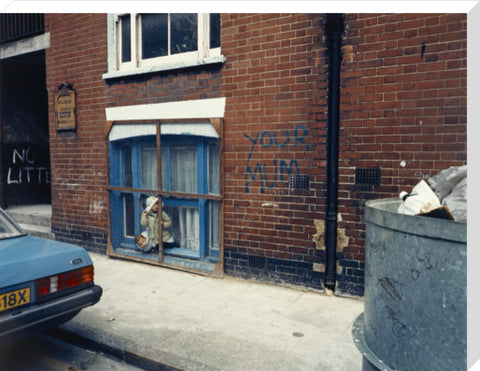 Two children looking out of a window 1986