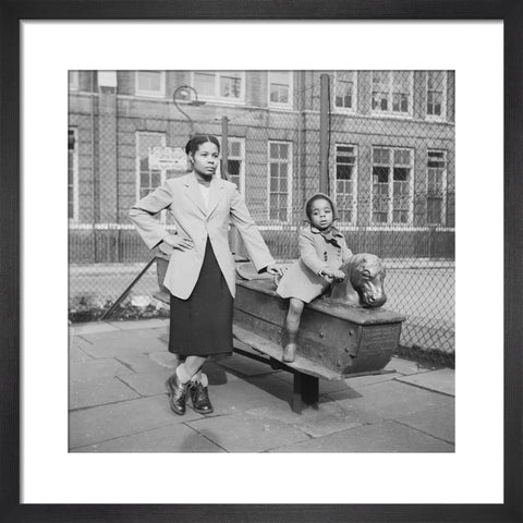 East London Afro-Caribbean child and mother in playground 1952