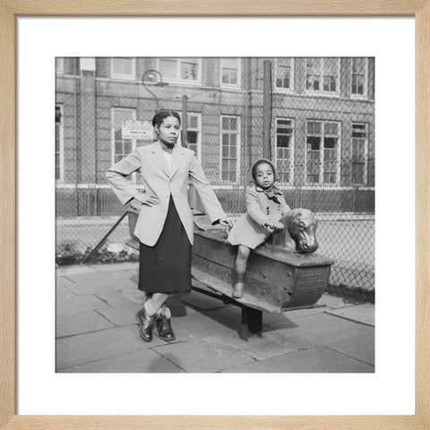 East London Afro-Caribbean child and mother in playground 1952