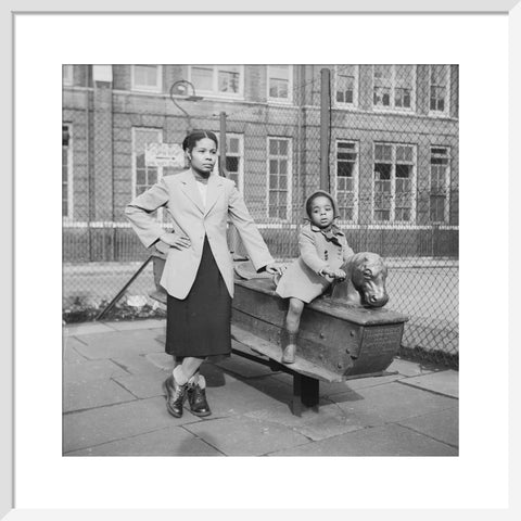 East London Afro-Caribbean child and mother in playground 1952