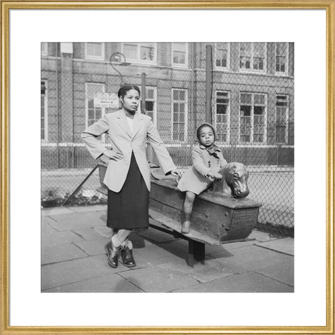 East London Afro-Caribbean child and mother in playground 1952