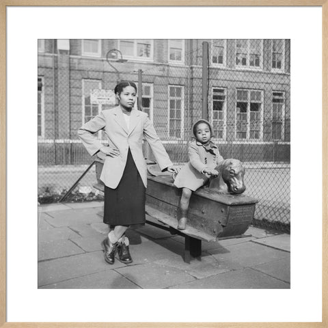 East London Afro-Caribbean child and mother in playground 1952
