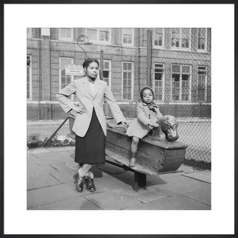 East London Afro-Caribbean child and mother in playground 1952