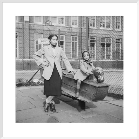 East London Afro-Caribbean child and mother in playground 1952