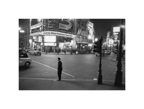 Lone man in Piccadilly at night 1960