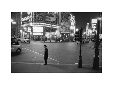 Lone man in Piccadilly at night 1960