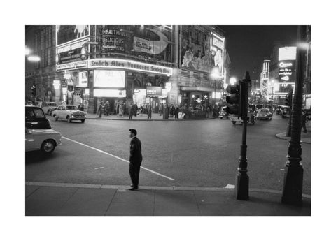 Lone man in Piccadilly at night 1960