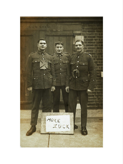 Three soldiers stand with a message of Hope c.1914