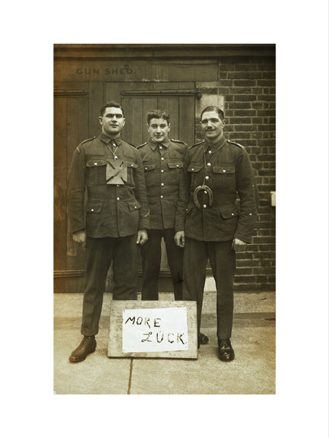 Three soldiers stand with a message of Hope c.1914