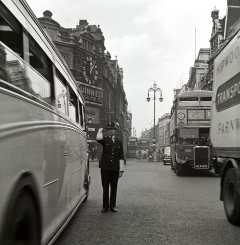 A policeman directing traffic New Oxford Street. c.1955