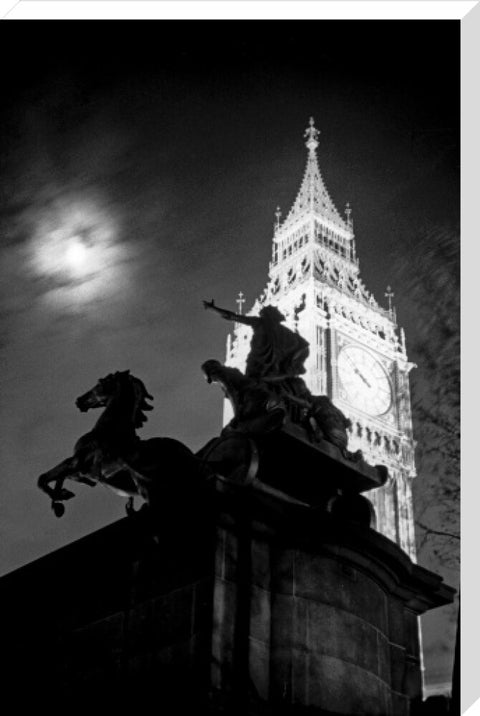 Statue of Boudica with Big Ben floodlit behind.