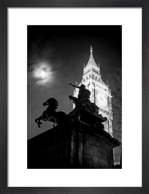 Statue of Boudica with Big Ben floodlit behind.
