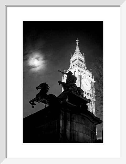 Statue of Boudica with Big Ben floodlit behind.