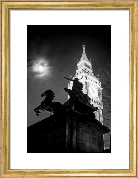 Statue of Boudica with Big Ben floodlit behind.