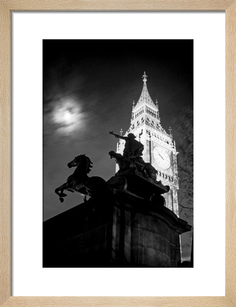 Statue of Boudica with Big Ben floodlit behind.