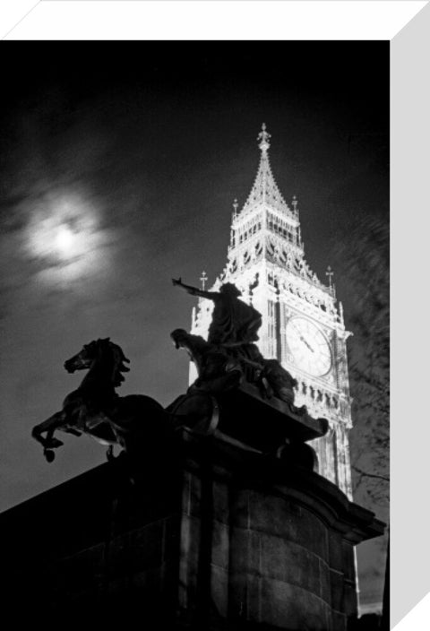 Statue of Boudica with Big Ben floodlit behind.