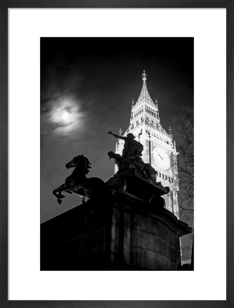 Statue of Boudica with Big Ben floodlit behind.