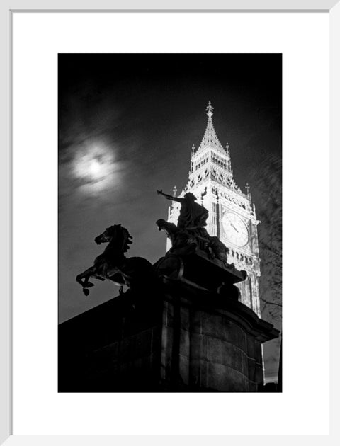 Statue of Boudica with Big Ben floodlit behind.