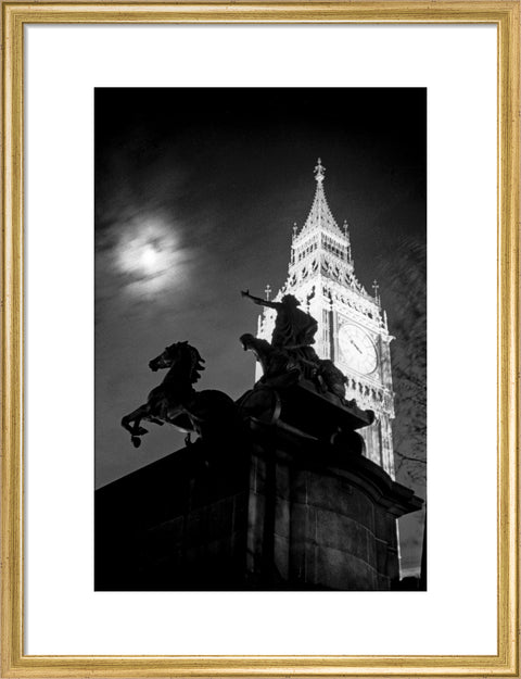 Statue of Boudica with Big Ben floodlit behind.