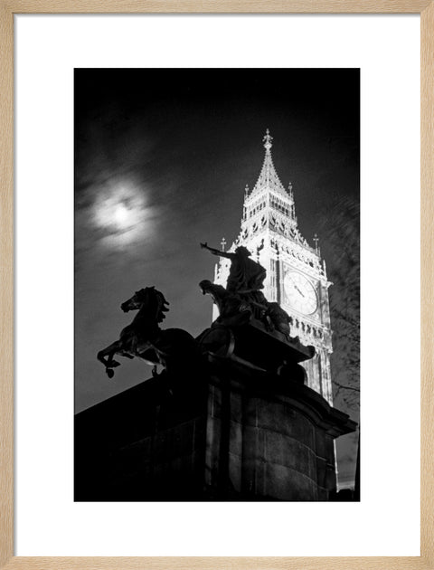 Statue of Boudica with Big Ben floodlit behind.